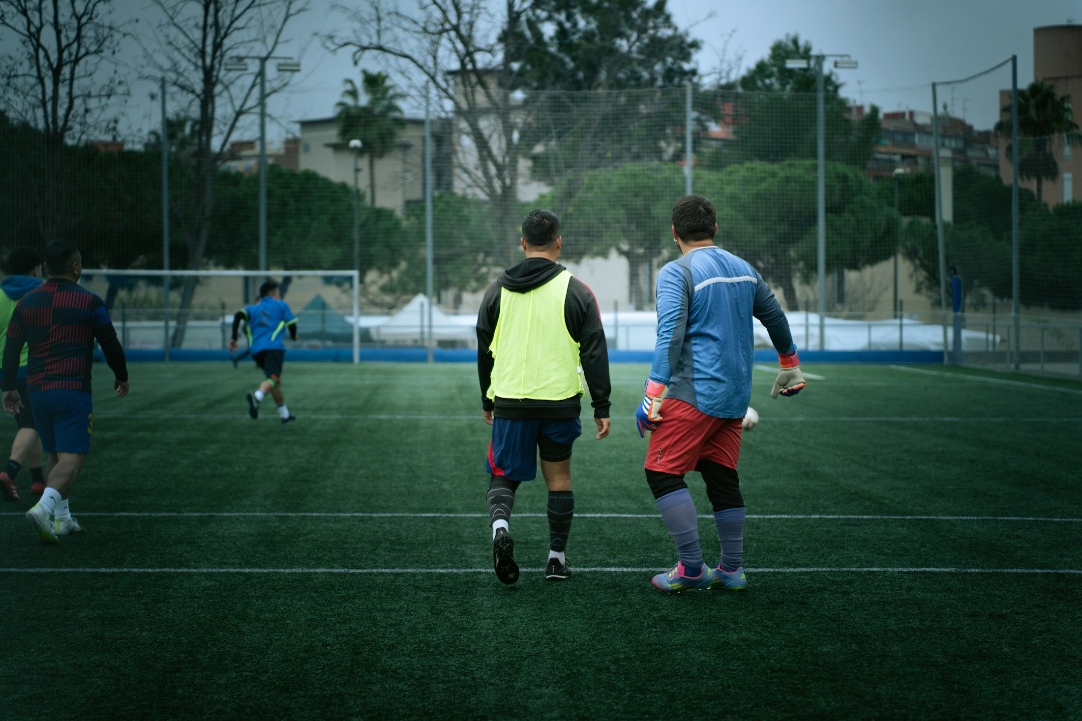 Football players training on an outdoor pitch